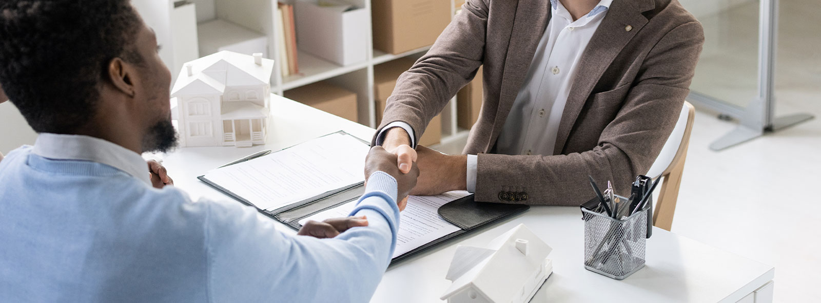 People shaking hands in an office