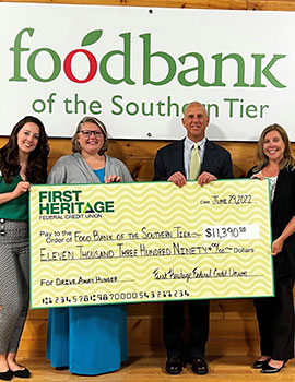 People holding a large check for the Food Bank of The Southern Tier