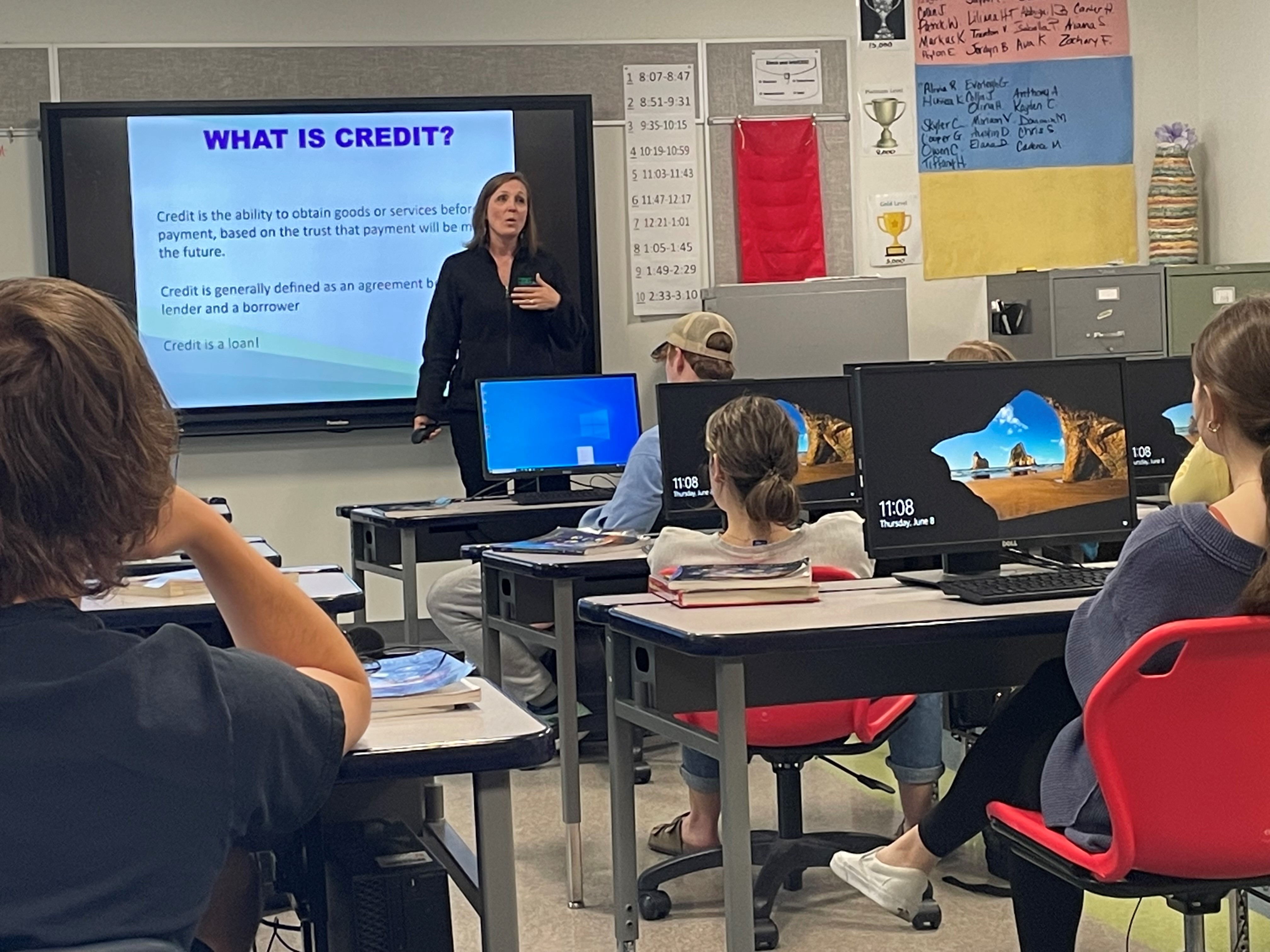 Christy presenting financial champions at Hornell High School