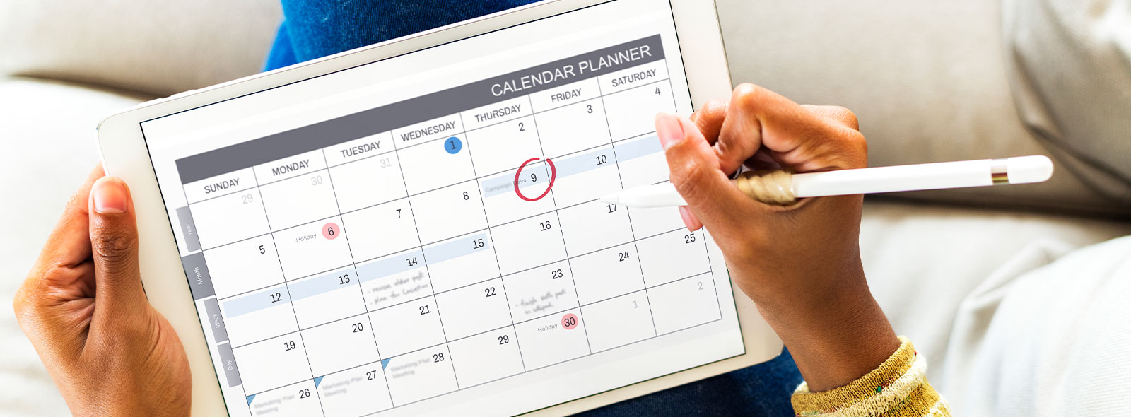 Person on tablet looking at their calendar