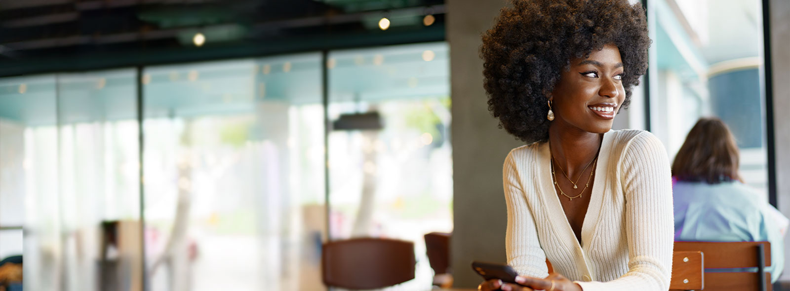 Young woman sitting in a restaurant.