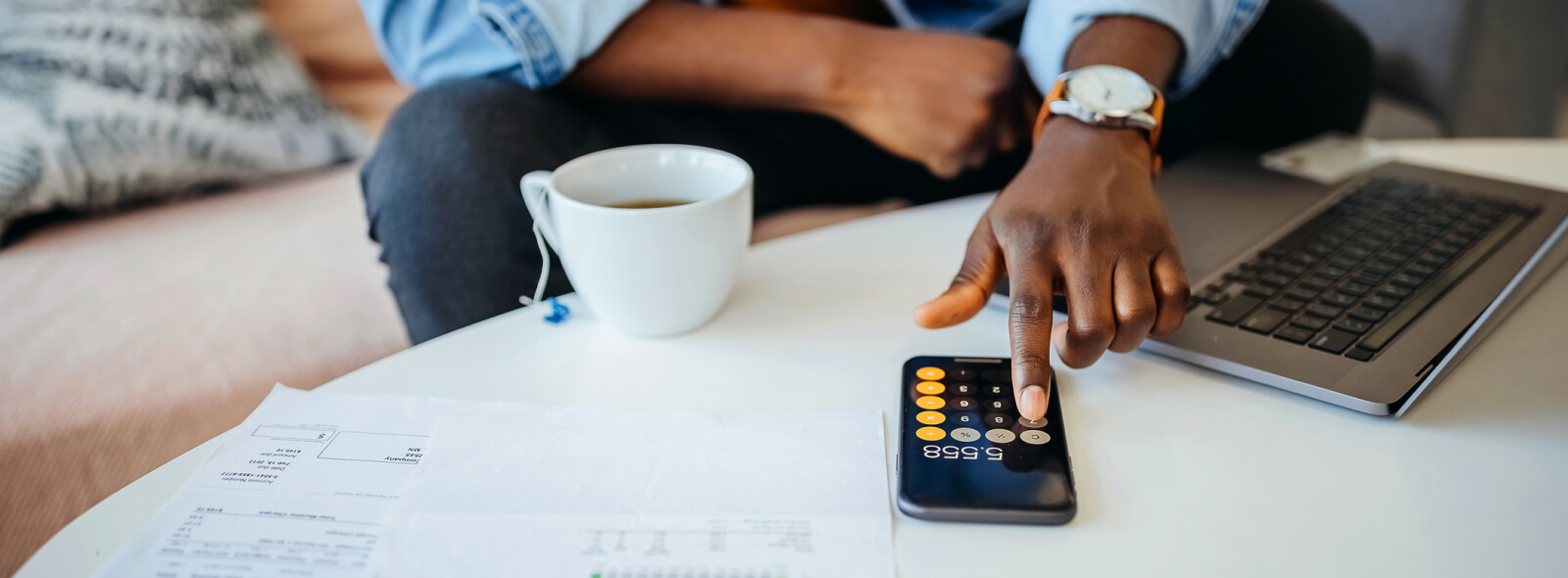 Man using phone as calculator