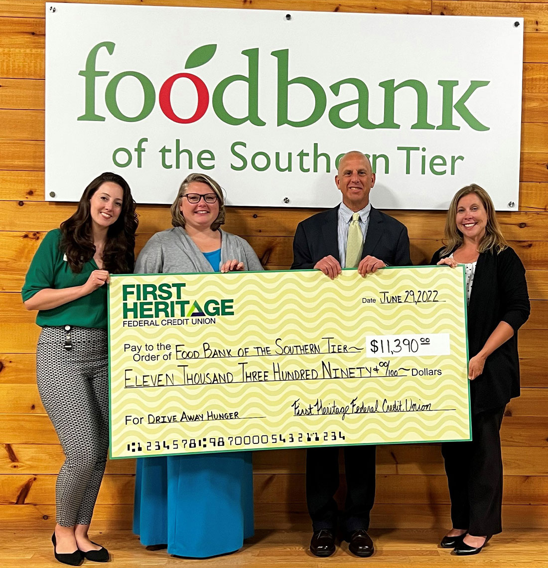 People holding a large check for the Food Bank of The Southern Tier