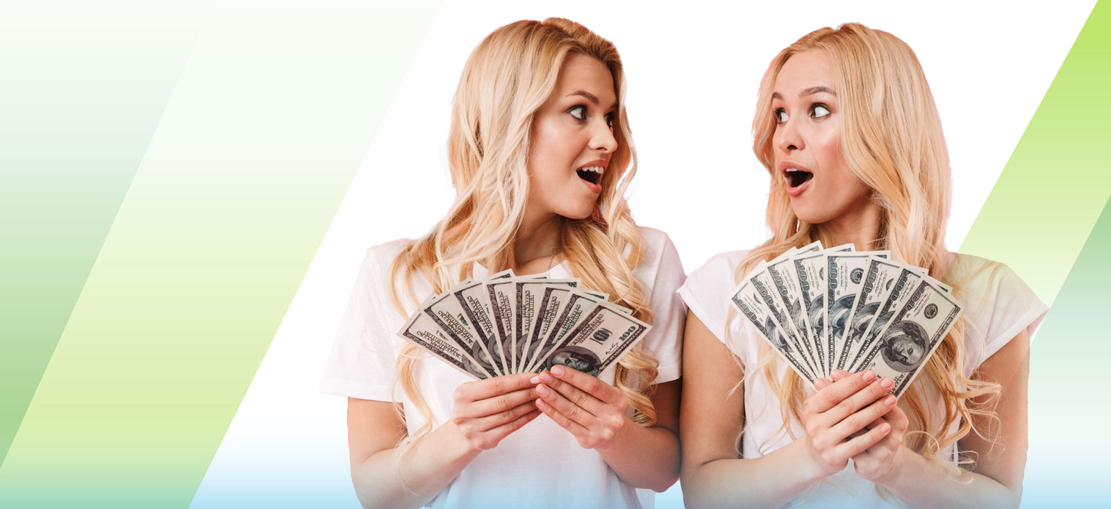 Two woman fanning out bills.