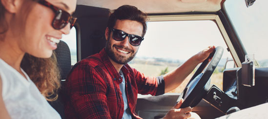 Man smiling while driving